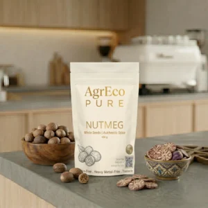Organic Whole Nutmeg Online by AgrEco Pure displayed with premium whole nutmeg seeds and sliced nutmeg in a modern kitchen setting